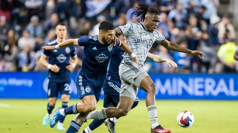 CF Montreal forward Chinonso Offor, right, runs past Sporting Kansas City defender Robert Castellanos, left, during the second half of an MLS soccer match aturday, April 29, 2023, in Kansas City, Kan. (Nick Tre. Smith/AP)