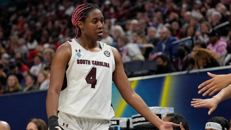 South Carolina's Aliyah Boston is congratulated by the bench during the second half of a college basketball game in the semifinal round of the Women's Final Four NCAA tournament Friday, April 1, 2022, in Minneapolis. (AP Photo/Eric Gay)