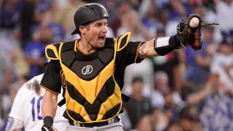 Pittsburgh Pirates catcher Tyler Heineman gestures toward centre fielder Bryan Reynolds after Reynolds threw out Los Angeles Dodgers' Gavin Lux at home during the seventh inning of a baseball game Wednesday, June 1, 2022, in Los Angeles. (Mark J. Terrill/AP) 