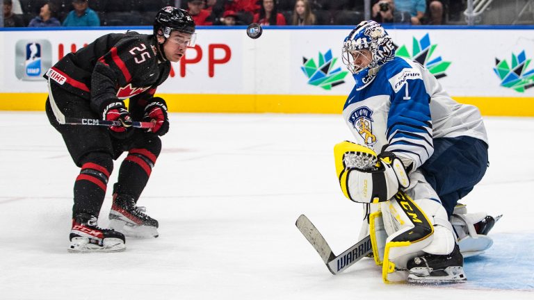 Canada's William Dufour (25) is stopped by Finland goalie Leevi Merilainen (1) during second period IIHF World Junior Hockey Championship action in Edmonton on Monday August 15, 2022. (Jason Franson/CP)