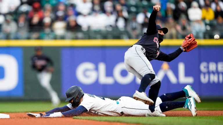 Seattle Mariners' Julio Rodriguez steals second as Cleveland Guardians second baseman Andres Gimenez waits for the throw during the first inning of a baseball game Saturday, April 1, 2023, in Seattle. (Lindsey Wasson/AP) 