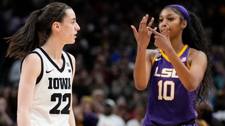 LSU's Angel Reese reacts in front of Iowa's Caitlin Clark during the second half of the NCAA Women's Final Four championship basketball game Sunday, April 2, 2023, in Dallas. LSU won 102-85 to win the championship. (AP Photo/Tony Gutierrez)