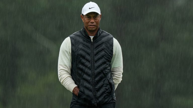 Tiger Woods walks on the 18th hole during the weather delayed second round of the Masters golf tournament at Augusta National Golf Club on Saturday, April 8, 2023, in Augusta, Ga. (Charlie Riedel/AP) 