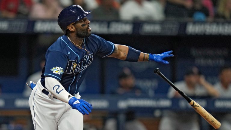 Tampa Bay Rays' Yandy Diaz watches his run-scoring sacrifice fly off Boston Red Sox starting pitcher Chris Sale during the fourth inning of a baseball game Wednesday, April 12, 2023, in St. Petersburg, Fla. Rays' Taylor Walls scored on the play. (AP Photo/Chris O'Meara) 