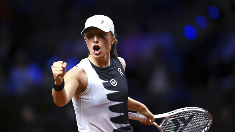 Poland's Iga Swiatek celebrates a point against Belarus' Aryna Sabalenka during the WTA women's singles final match at Porsche Arena, Stuttgart, Germany, Sunday April 23, 2023. (Marijan Murat/dpa via AP)