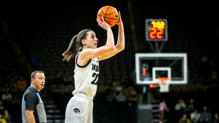 Iowa guard Caitlin Clark (22) makes a 3-point basket during an NCAA college basketball game against Dartmouth, Wednesday, Dec. 21, 2022, at Carver-Hawkeye Arena in Iowa City, Iowa. (Joseph Cress/Iowa City Press-Citizen via AP)