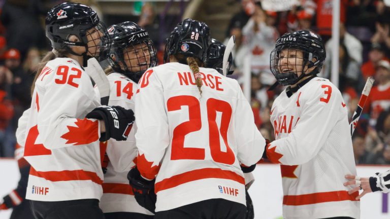 Canada defender Renata Fast (14) celebrates a goal with forward Danielle Serdachny (92), forward Sarah Nurse (20), and defender Jocelyne Larocque (3) during first period IIHF Women’s World Hockey Championship hockey action against Japan in Brampton, Ont., on Saturday, April 8, 2023. (Cole Burston/CP)