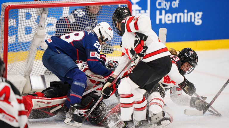 Players of Canada and USA during the IIHF World Championship Woman's ice hockey gold medal match between USA and Canada in Herning, Denmark, Sunday, Sept. 4, 2022. (Bo Amstrup/Ritzau Scanpix via AP)