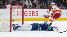 Controversial late penalty costs Canucks an undeserved win over Flames