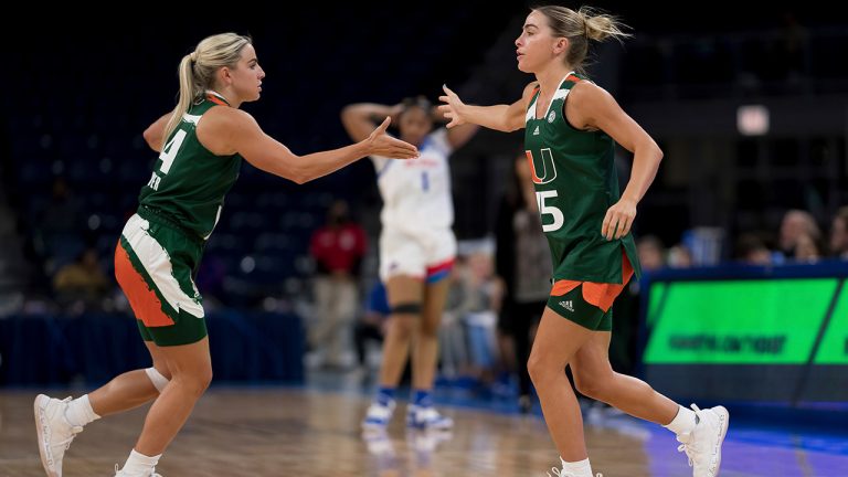 Miami NCAA college basketball guards and sisters, Haley and Hanna Cavinder, are shown during a game against DePaul on Sunday, Nov. 20, 2022, in Chicago.(Matt Dirksen/AP)