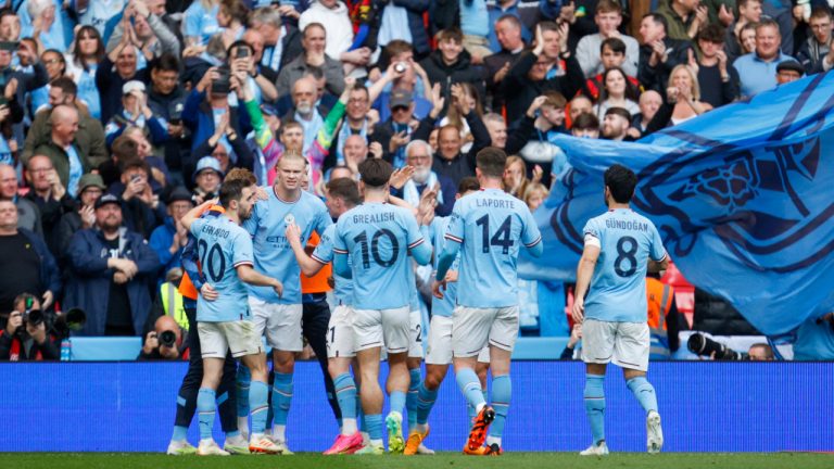 Manchester City's Riyad Mahrez celebrates with teammates after scoring his side's third goal during the English FA Cup semi final soccer match between Manchester City and Sheffield United at Wembley stadium, in London, Saturday, April 22, 2023. (David Cliff/AP)