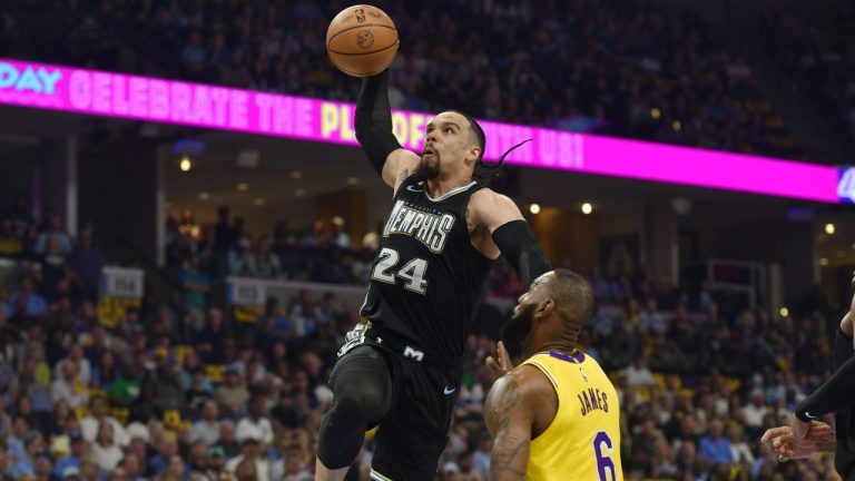 Memphis Grizzlies forward Dillon Brooks (24) goes sup for a dunk against Los Angeles Lakers forward LeBron James (6) during the first half of Game 2 of a first-round NBA basketball playoff series Wednesday, April 19, 2023, in Memphis, Tenn. (Brandon Dill/AP)