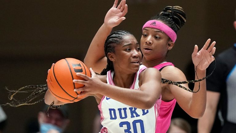 Duke guard Shayeann Day-Wilson is pressured by North Carolina State guard Kai Crutchfield during the first half of an NCAA college basketball game in Durham, N.C., Sunday, Feb. 13, 2022. (Gerry Broome/AP Photo)