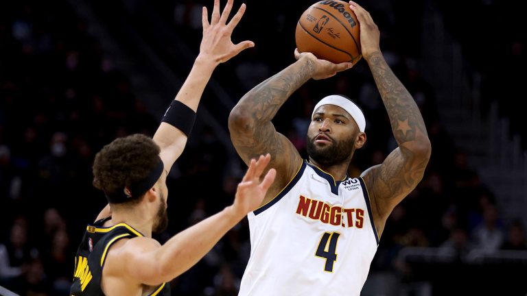 Denver Nuggets center DeMarcus Cousins (4) shoots against Golden State Warriors guard Klay Thompson, left, during the first half of Game 5 of an NBA basketball first-round playoff series in San Francisco, Wednesday, April 27, 2022. (Jed Jacobsohn/AP)