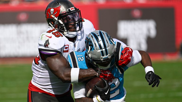 Carolina Panthers wide receiver Shi Smith is tackled by Tampa Bay Buccaneers linebacker Devin White during the first half of an NFL football game between the Carolina Panthers and the Tampa Bay Buccaneers on Sunday, Jan. 1, 2023, in Tampa, Fla. (Jason Behnken/AP)