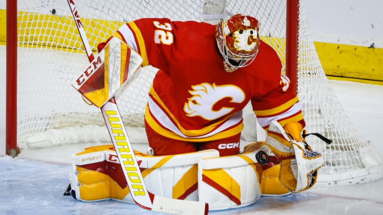 Calgary Flames goalie Dustin Wolf makes a save during first period NHL hockey action against the San Jose Sharks in Calgary, Wednesday, April 12, 2023. (Jeff McIntosh/CP)