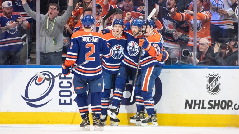 Edmonton Oilers' Evan Bouchard (2), Zach Hyman (18), Leon Draisaitl (29) and Ryan Nugent-Hopkins (93) celebrate a goal against the Los Angeles Kings during first period NHL Stanley Cup first round playoff action in Edmonton on Wednesday April 19, 2023. (Jason Franson/CP)