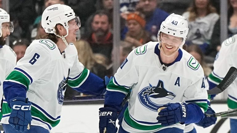 Vancouver Canucks center Elias Pettersson, right, celebrates his goal with right wing Brock Boeser during the first period of an NHL hockey game against the Anaheim Ducks Tuesday, April 11, 2023, in Anaheim, Calif. (Mark J. Terrill/AP)