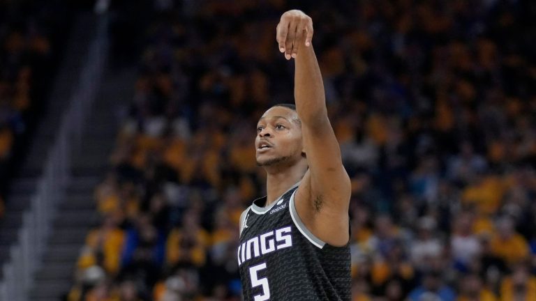 Sacramento Kings guard De'Aaron Fox gestures after making a 3-point basket against the Golden State Warriors during the first half of Game 4 in the first round of the NBA basketball playoffs in San Francisco, Sunday, April 23, 2023. (Jeff Chiu/AP Photo)