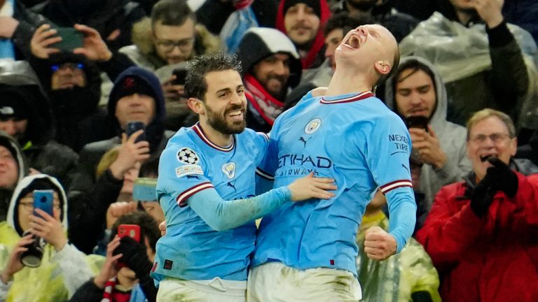 Manchester City's Erling Haaland, right, celebrates after scoring his side's third goal during the Champions League quarterfinal, first leg, soccer match between Manchester City and Bayern Munich at the Etihad stadium in Manchester, England, Tuesday, April 11, 2023. (Jon Super/AP)