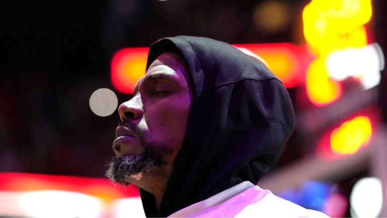 Miami Heat forward Udonis Haslem stands for the national anthem before an NBA basketball game against the Orlando Magic, Sunday, April 9, 2023, in Miami. (Lynne Sladky/AP Photo)