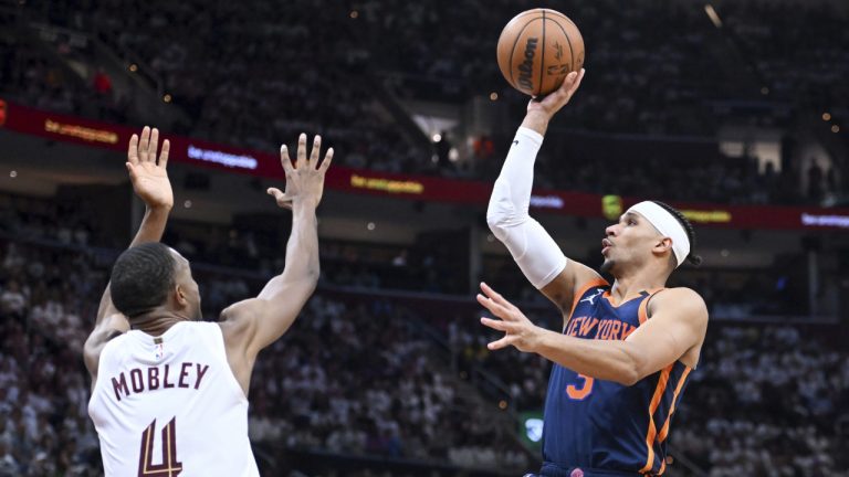 New York Knicks' Josh Hart (3) shoots against Cleveland Cavaliers' Evan Mobley (4) during the second half of Game 1 in a first-round NBA basketball playoffs series Saturday, April 15, 2023, in Cleveland. (Nick Cammett/AP)