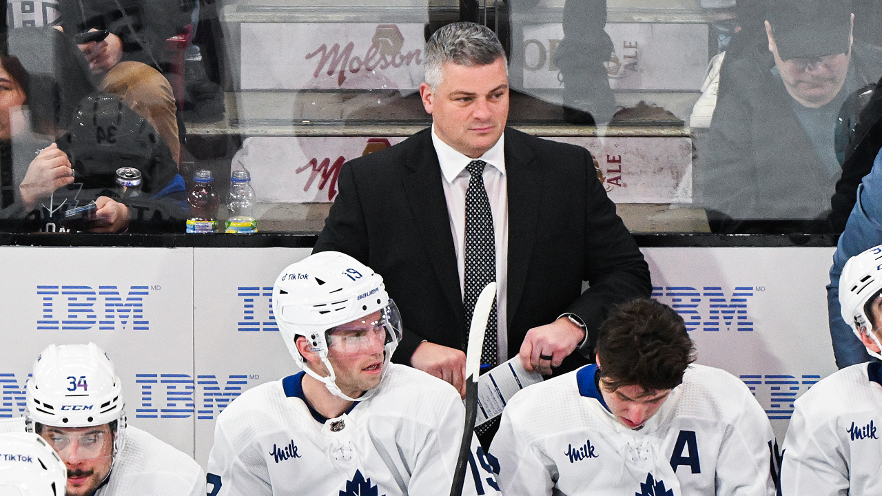 Maple Leafs fans celebrate after eagle-eye coaches catch hand pass vs. Flames