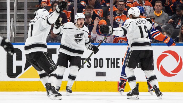 Los Angeles Kings left wing Alex Iafallo (19) celebrates his goal against the Edmonton Oilers with teammates Anze Kopitar (11), Viktor Arvidsson (33) during overtime NHL Stanley Cup first round playoff action in Edmonton on Monday April 17, 2023. (Jason Franson/THE CANADIAN PRESS)