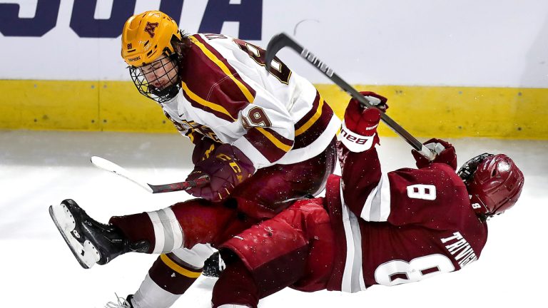 Boston 03/25/22  NCAA Regional Tournament- UMass vs Minnesota- Massachusetts forward Bobby Trivigno (8) best checked hard by Minnesota’s Matthew Knies in the 2nd period. (John Tlumacki/Globe Staff)