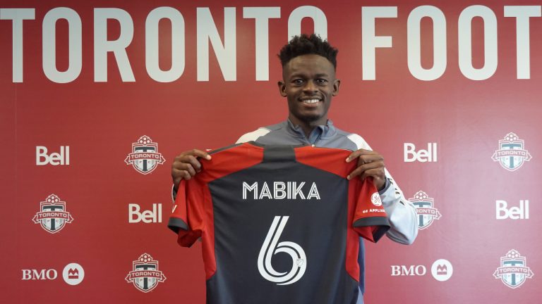 Newly acquired centre back Aime Mabika is shown displaying his Toronto CF jersey at the MLS club's training facility on Thursday April 27, 2023. Mabika came over in a trade with Inter Miami CF. (Neil Davidson/CP)