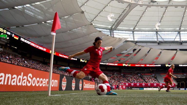 Canada's Diana Matheson takes a corner kick against Germany during the first half of an international women's soccer game in Vancouver, B.C. (Darryl Dyck/CP)