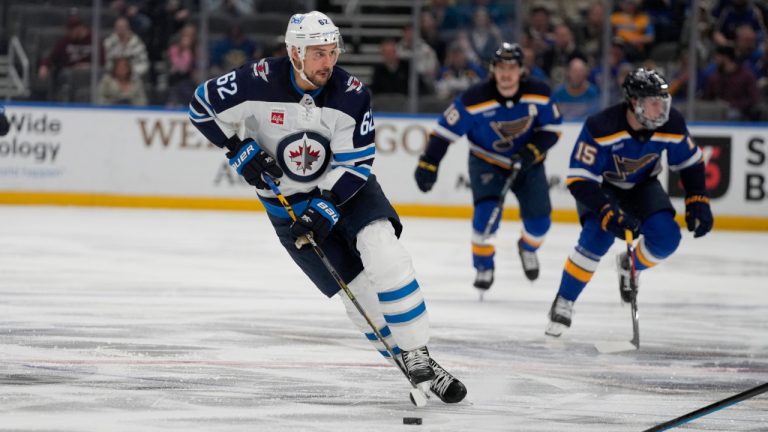 Winnipeg Jets' Nino Niederreiter brings the puck down the ice during the first period of an NHL hockey game against the St. Louis Blues Sunday, March 19, 2023, in St. Louis. (Jeff Roberson/AP)