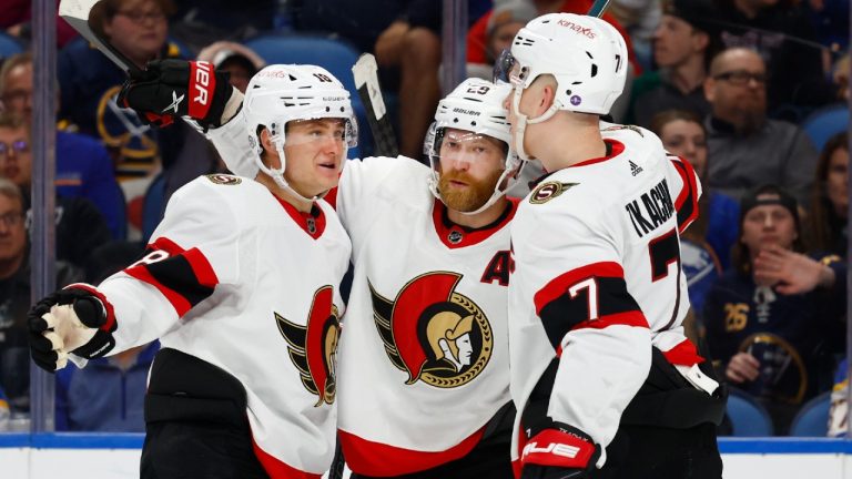 Ottawa Senators right wing Claude Giroux, centre, celebrates his goal against the Buffalo Sabres with left wing Tim Stutzle (18) and left wing Brady Tkachuk (7) during the second period of an NHL hockey game Thursday, April 13, 2023, in Buffalo, N.Y. (Jeffrey T. Barnes/AP)