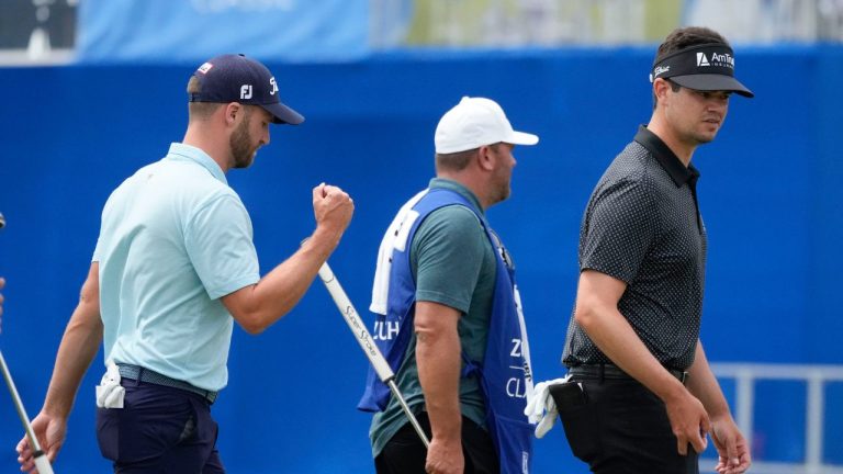 Wyndham Clark, left, and his teammate Beau Hossler, right, walk off the 9th green after finishing for the day during the second round of the PGA Zurich Classic golf tournament at TPC Louisiana in Avondale, La., Friday, April 21, 2023. (Gerald Herbert/AP Photo)