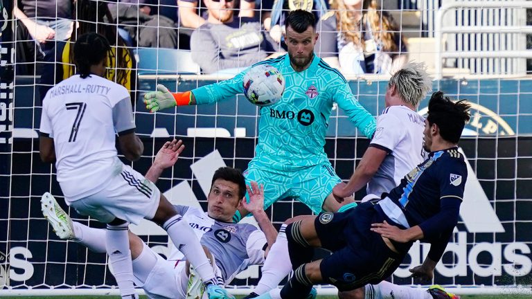 Philadelphia Union's Julian Carranza, right, tries to get a shot past Toronto FC keeper Quentin Westberg, centre, during the first half of an MLS soccer match, Sunday, Oct. 9, 2022, in Chester, Pa. (Matt Slocum/AP)