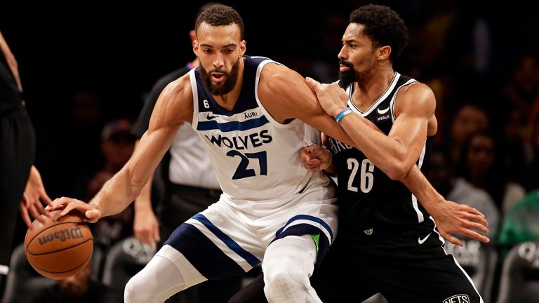 Minnesota Timberwolves center Rudy Gobert  drives to the basket against Brooklyn Nets guard Spencer Dinwiddie during the second half of an NBA basketball game, Tuesday, April 4, 2023, in New York. (Adam Hunger/AP)