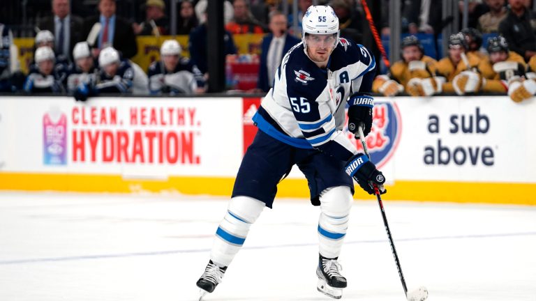 Winnipeg Jets centre Mark Scheifele (55) skates with the puck against the Vegas Golden Knights during the first period of Game 2 of an NHL hockey Stanley Cup first-round playoff series Thursday, April 20, 2023, in Las Vegas. (Lucas Peltier/AP)