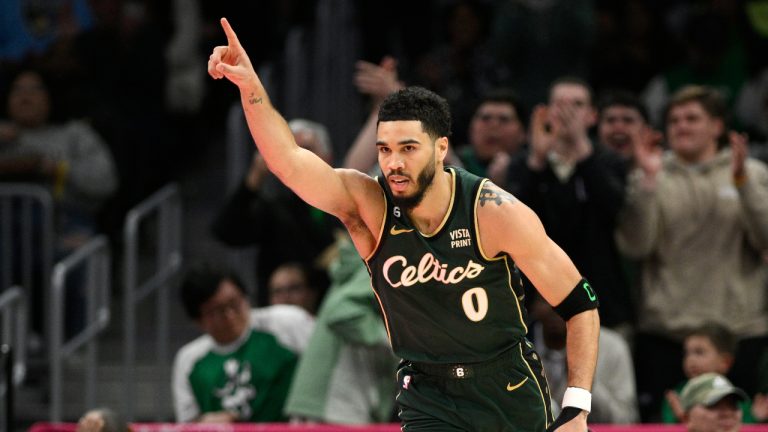 Boston Celtics forward Jayson Tatum (0) gestures during the first half of an NBA basketball game against the Washington Wizards, Tuesday, March 28, 2023, in Washington. (Nick Wass/AP)