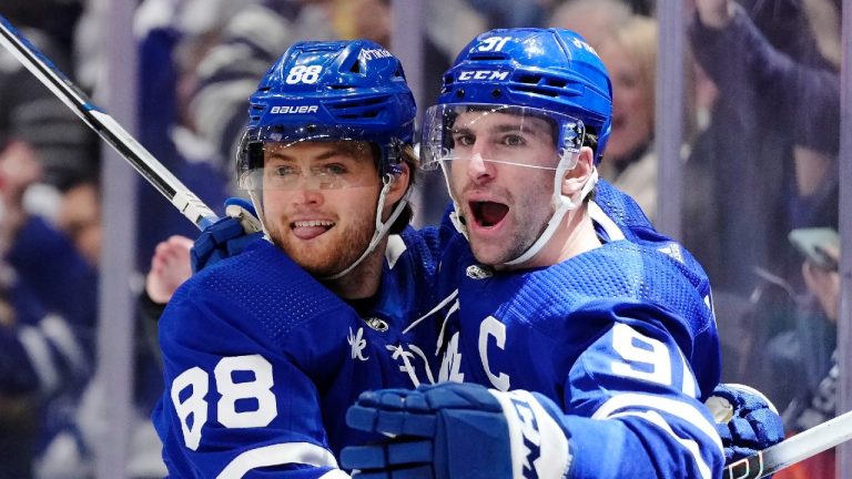 Toronto Maple Leafs forward John Tavares (91) celebrates his goal against the Tampa Bay Lightning with forward William Nylander (88) during second period NHL first round Stanley Cup playoff hockey action in Toronto, on Thursday, April 20, 2023. (Frank Gunn/CP)