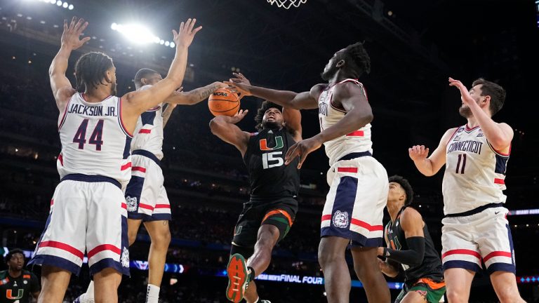 Miami forward Norchad Omier is blocked by Connecticut during the second half of a Final Four college basketball game in the NCAA Tournament on Saturday, April 1, 2023, in Houston. (Brynn Anderson/AP)