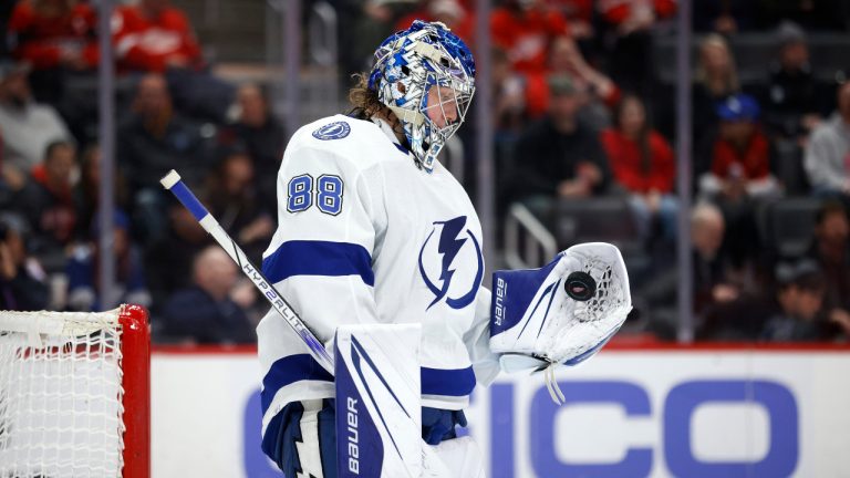 Tampa Bay Lightning goaltender Andrei Vasilevskiy (88) flips the puck in his glove after making a save against the Detroit Red Wings during the second period of an NHL hockey game Saturday, Feb. 25, 2023, in Detroit. (Al Goldis/AP)