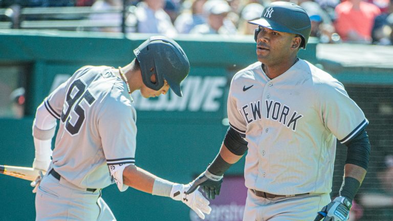 New York Yankees' Oswaldo Cabrera congratulates Franchy Cordero for his solo home run off Cleveland Guardians relief pitcher Trevor Stephan during the seventh inning of a baseball game in Cleveland, Wednesday April 12, 2023. (Phil Long/AP)