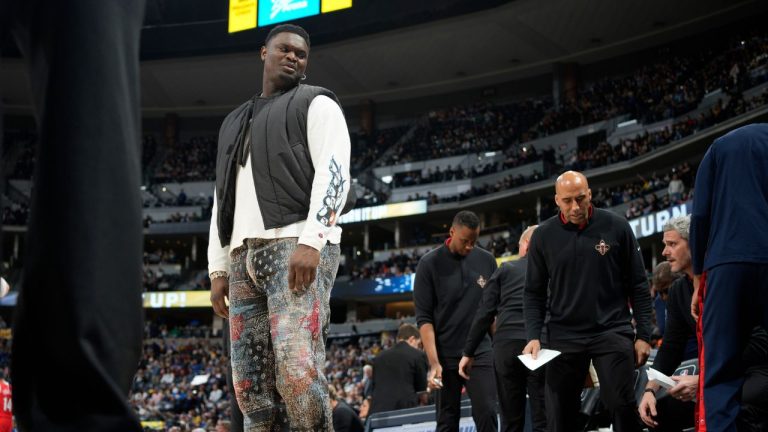 Injured New Orleans Pelicans forward Zion Williamson heads back to the bench after a timeout late in the second half of the team's NBA basketball game against the Denver Nuggets on Thursday, March 30, 2023, in Denver. (David Zalubowski/AP Photo)