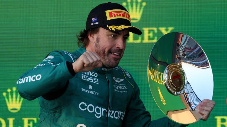 Aston Martin driver Fernando Alonso of Spain celebrates with his trophy after finishing 3rd in the Australian Formula One Grand Prix at Albert Park in Melbourne, Sunday, April 2, 2023. (Asanka Brendon Ratnayake/AP)