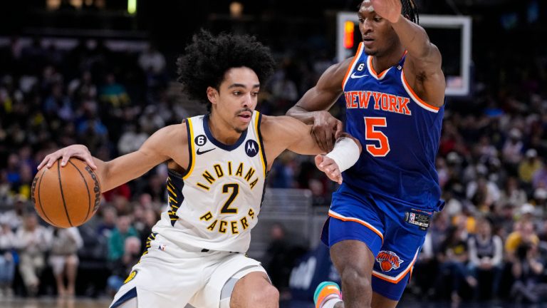 Indiana Pacers guard Andrew Nembhard (2) drives on New York Knicks guard Immanuel Quickley (5) during the first half of an NBA basketball game in Indianapolis, Wednesday, April 5, 2023. The Knicks defeatedThe Pacers 138-129. (Michael Conroy/AP)