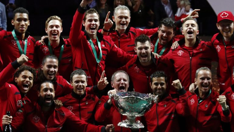 Team Canada celebrates with the trophy after winning the Davis Cup tennis final in Malaga, Spain, Sunday, Nov. 27, 2022. (AP)