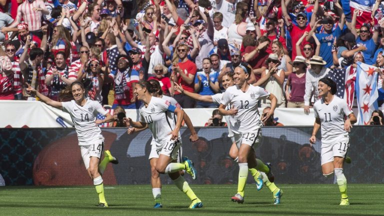 United States players (left to right) Morgan Brian (14), Carli Lloyd (10), Lauren Holiday (12) and Ali Krieger (11) celebrate Lloyd's second goal against Japan during first half final game soccer action at the FIFA Women's World Cup in Vancouver on Sunday, July 5, 2015. Canada Soccer says it was not consulted about the joint bid by the U.S. and Mexico to host the 2027 Women's World Cup. (Jonathan Hayward/CP)