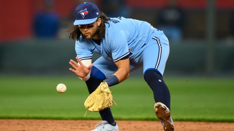 Toronto Blue Jays shortstop Bo Bichette collects a grounder off the bat of Kansas City Royals' Bobby Witt Jr. for an out at first base during the third inning of a baseball game, Tuesday, April 4, 2023, in Kansas City, Mo. (Reed Hoffmann/AP)