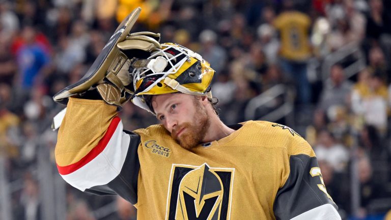 Vegas Golden Knights goaltender Laurent Brossoit adjusts his helmet during the third period of Game 5 of the team's NHL hockey Stanley Cup first-round playoff series against the Winnipeg Jets. (David Becker/AP)