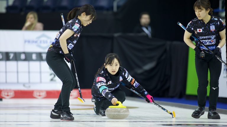 Satsuki Fujisawa (centre) shoots a stone during the second draw of the Princess Auto Players' Championship on Tuesday, April 11, 2023, in Toronto. (Anil Mungal/GSOC)